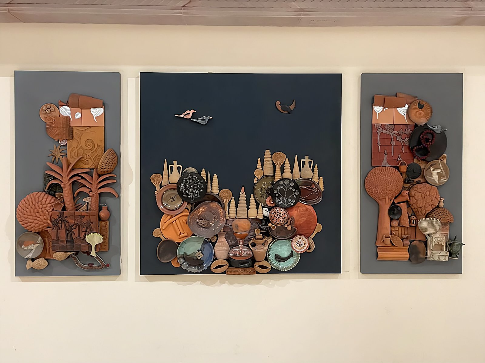 Installed terracotta mural artwork on an interior wall